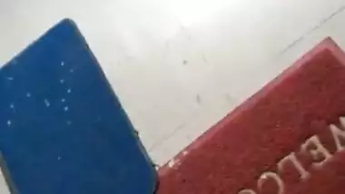 Boy rubbing his pennies infront of maid