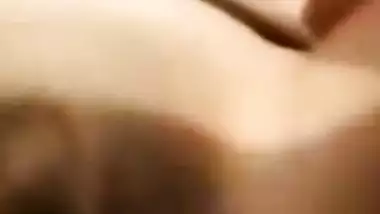 Amateur Desi girl spreads broken pussy lips and fucks herself in bed